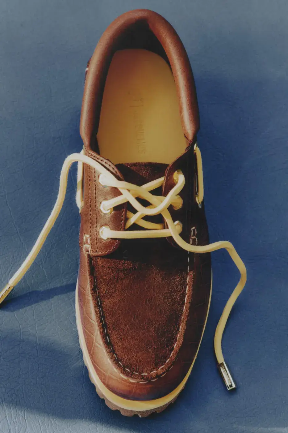 TIMBERLAND X JACQUEMUS BOAT SHOE IN CROC-EMBOSSED LEATHER image of Timberland x Jacquemus Authentic Boat Shoe in Brown Croc and Navy Croc, both made from crocodile-embossed leather with a rubber outsole. (image 6 of 9)