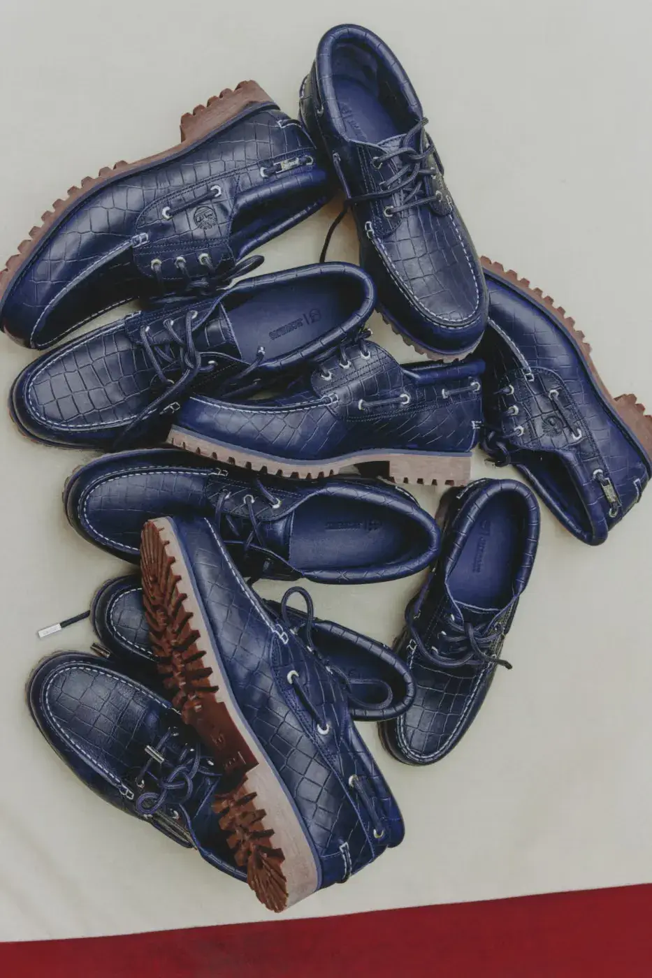TIMBERLAND X JACQUEMUS BOAT SHOE IN CROC-EMBOSSED LEATHER image of Timberland x Jacquemus Authentic Boat Shoe in Brown Croc and Navy Croc, both made from crocodile-embossed leather with a rubber outsole. (image 7 of 9)
