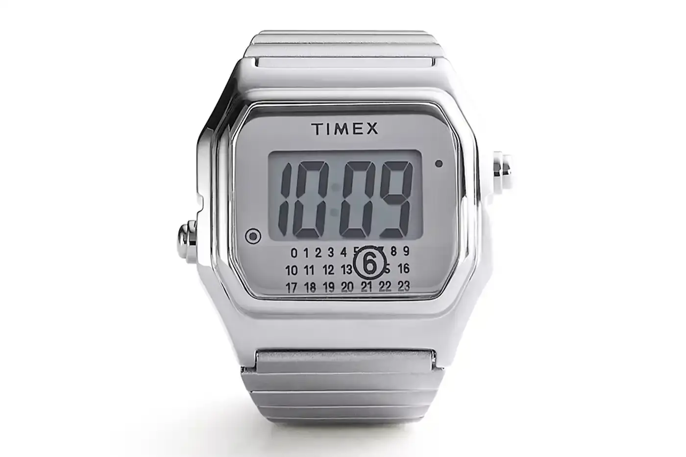 TIMEX X MM6 MAISON MARGIELA LAUNCH T80 DIGITAL WATCH COLLECTION Two Timex x MM6 Maison Margiela T80 digital watches displayed on a light background - a wristwatch and ring watch in mirror-finish stainless steel