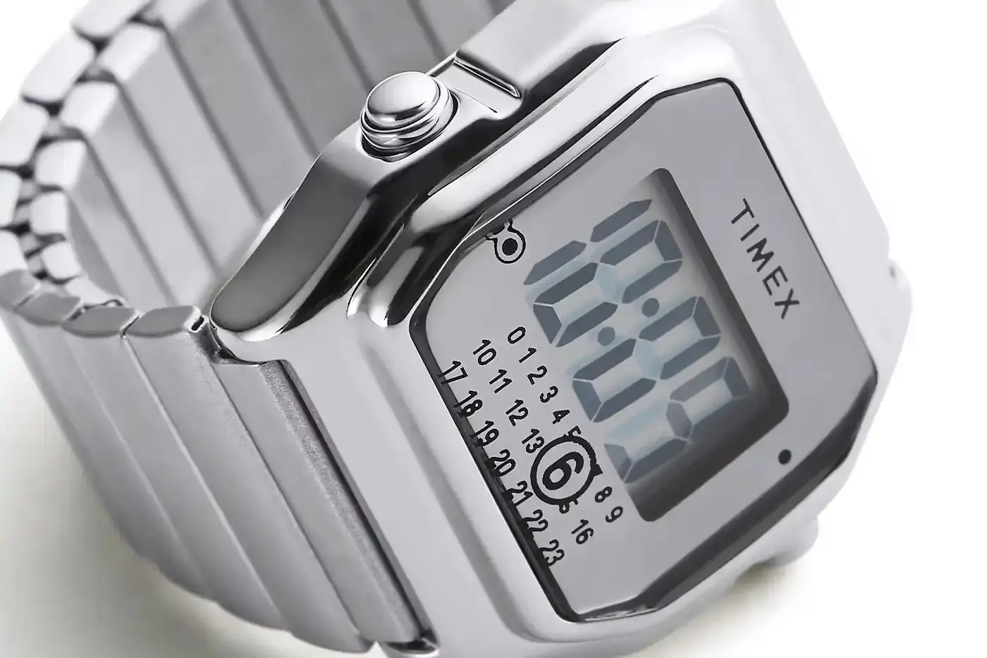 TIMEX X MM6 MAISON MARGIELA LAUNCH T80 DIGITAL WATCH COLLECTION Two Timex x MM6 Maison Margiela T80 digital watches displayed on a light background - a wristwatch and ring watch in mirror-finish stainless steel (image 4 of 7)