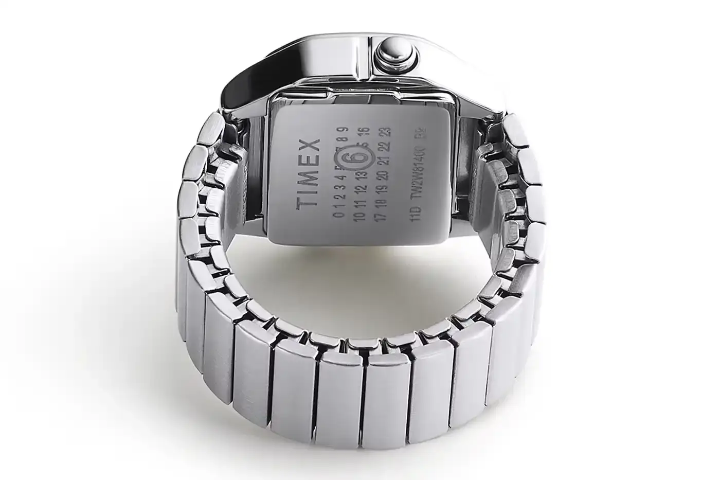 TIMEX X MM6 MAISON MARGIELA LAUNCH T80 DIGITAL WATCH COLLECTION Two Timex x MM6 Maison Margiela T80 digital watches displayed on a light background - a wristwatch and ring watch in mirror-finish stainless steel (image 3 of 7)