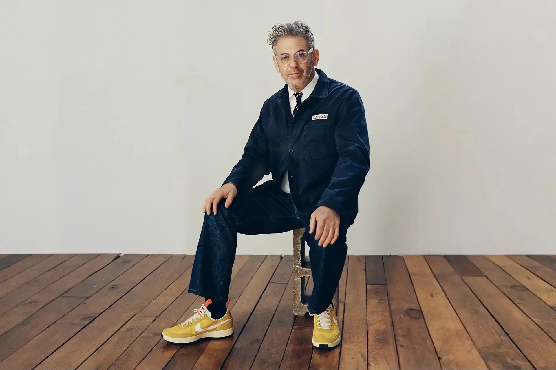 Tom Sachs and Nike resume partnership in 2025 after 18-month hiatus. New Mars Yard 3.0 sneaker planned. Collaboration paused in 2023 due to workplace behavior concerns. Nike cites Sachs' commitment to respect and inclusivity. Previous NikeCraft releases include Mars Yard series and General Purpose Shoe. Parallels drawn to Nike-Travis Scott partnership pause and resumption.
