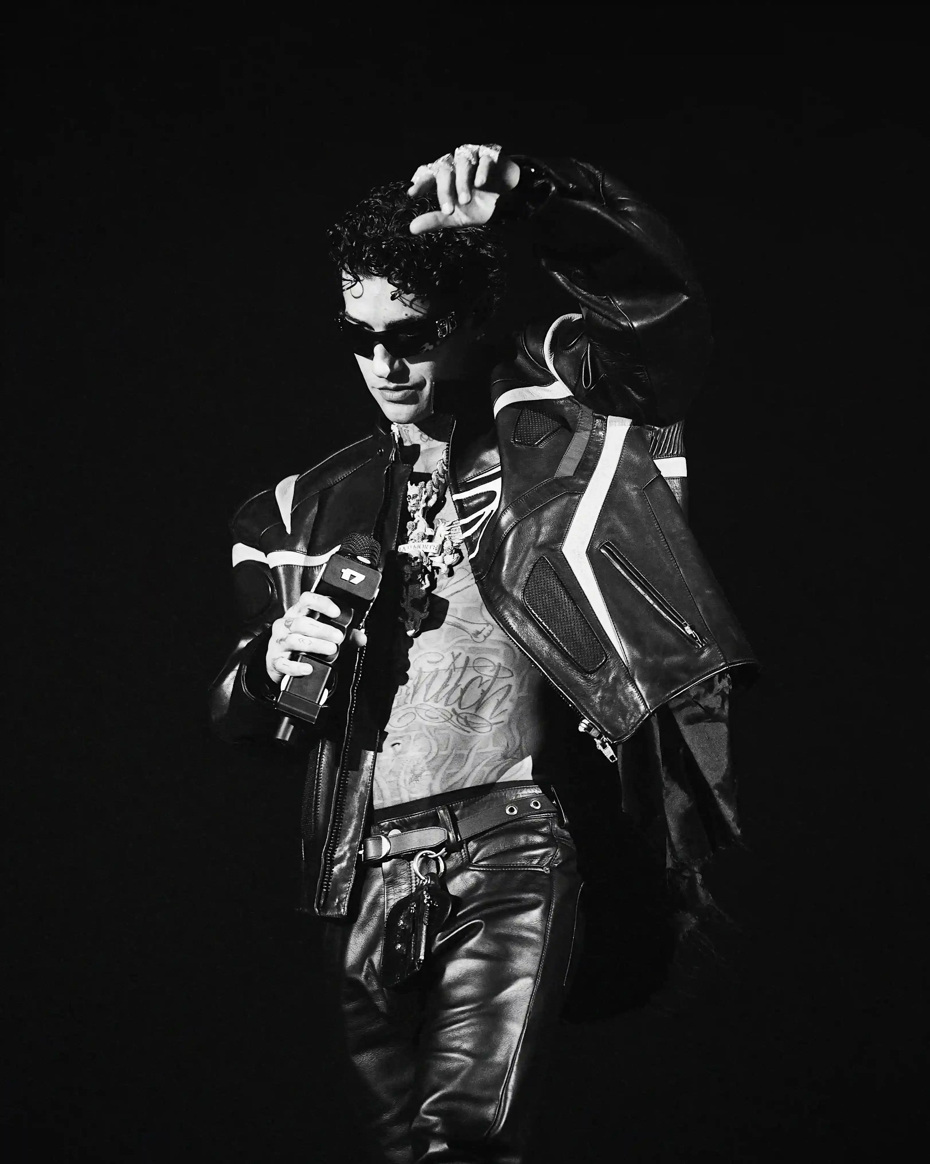 Tony Effe performs at sold-out concert in Milan's Unipol Forum. Young fans fill venue for Dark Polo Gang member's show featuring multiple guest artists. Performance showcases Tony's artistic growth and trap music's evolution in Italy