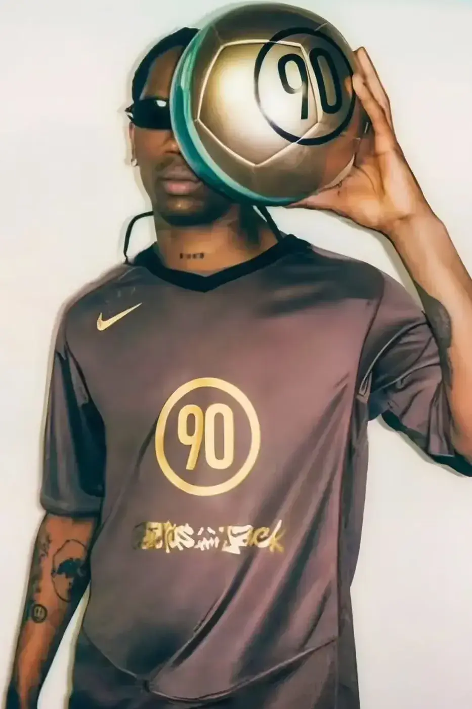 TRAVIS SCOTT NIKE TOTAL 90 WORLD CUP DROP image detailing the upcoming Travis Scott and Nike Total 90 football apparel collaboration for the 2026 World Cup.