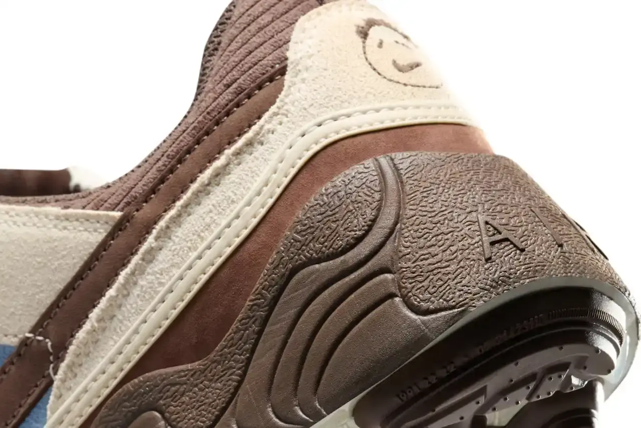 NIKE UNVEILS TRAVIS SCOTT'S ZOOM FIELD JAXX IN "LECHE BLUE" Image of the upcoming release of the Travis Scott x Nike Zoom Field Jaxx sneaker in "Leche Blue" colorway. It details the shoe's design inspiration from the Zoom Spiridon runner and Land Shark baseball cleat, describes the blue and brown color scheme, mentions the $170 price point, and notes the May 16 release date through Nike SNKRS and select retailers. (image 7 of 7)