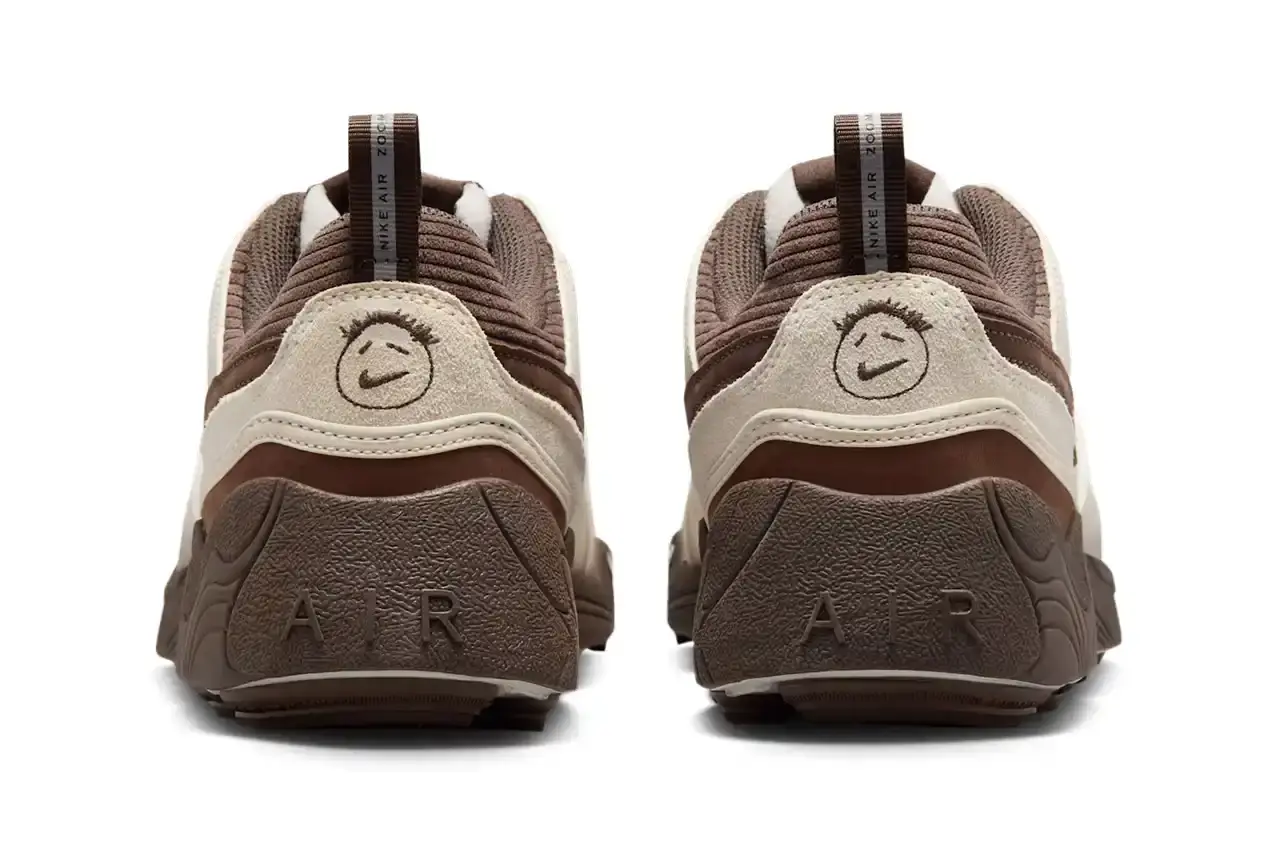 NIKE UNVEILS TRAVIS SCOTT'S ZOOM FIELD JAXX IN "LECHE BLUE" Image of the upcoming release of the Travis Scott x Nike Zoom Field Jaxx sneaker in "Leche Blue" colorway. It details the shoe's design inspiration from the Zoom Spiridon runner and Land Shark baseball cleat, describes the blue and brown color scheme, mentions the $170 price point, and notes the May 16 release date through Nike SNKRS and select retailers. (image 5 of 7)