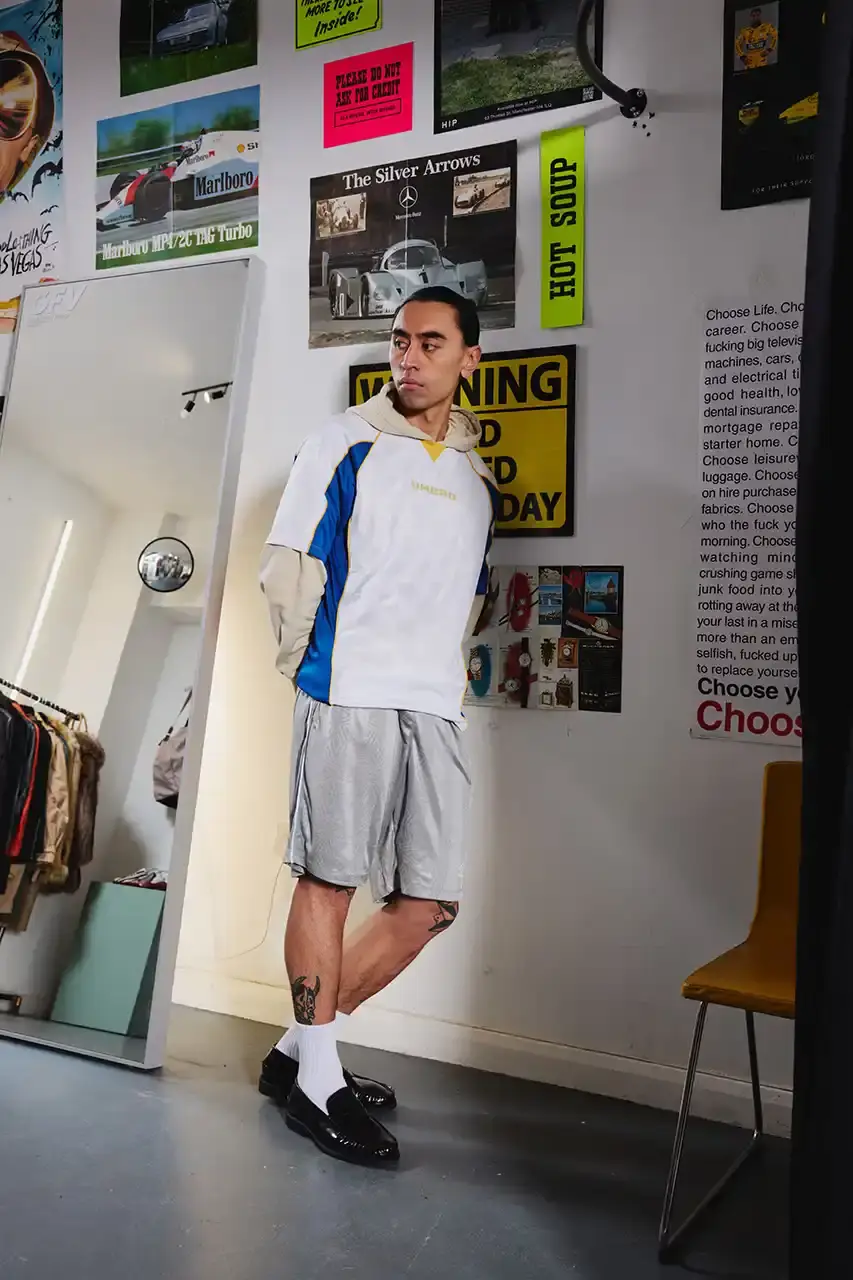 Umbro Umbro SS25 Northern Quarter collection featuring redesigned sportswear classics in white, red, black and charcoal gray, including the Zip Off Sleeve Wind Jacket and '90s-inspired Washed Drill pieces that blend Manchester heritage with contemporary design. (image 11 of 15)