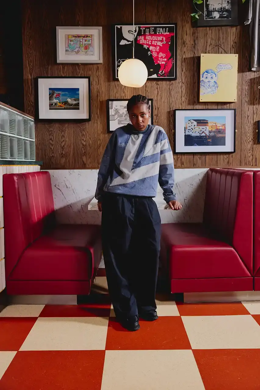 Umbro Umbro SS25 Northern Quarter collection featuring redesigned sportswear classics in white, red, black and charcoal gray, including the Zip Off Sleeve Wind Jacket and '90s-inspired Washed Drill pieces that blend Manchester heritage with contemporary design. (image 2 of 15)