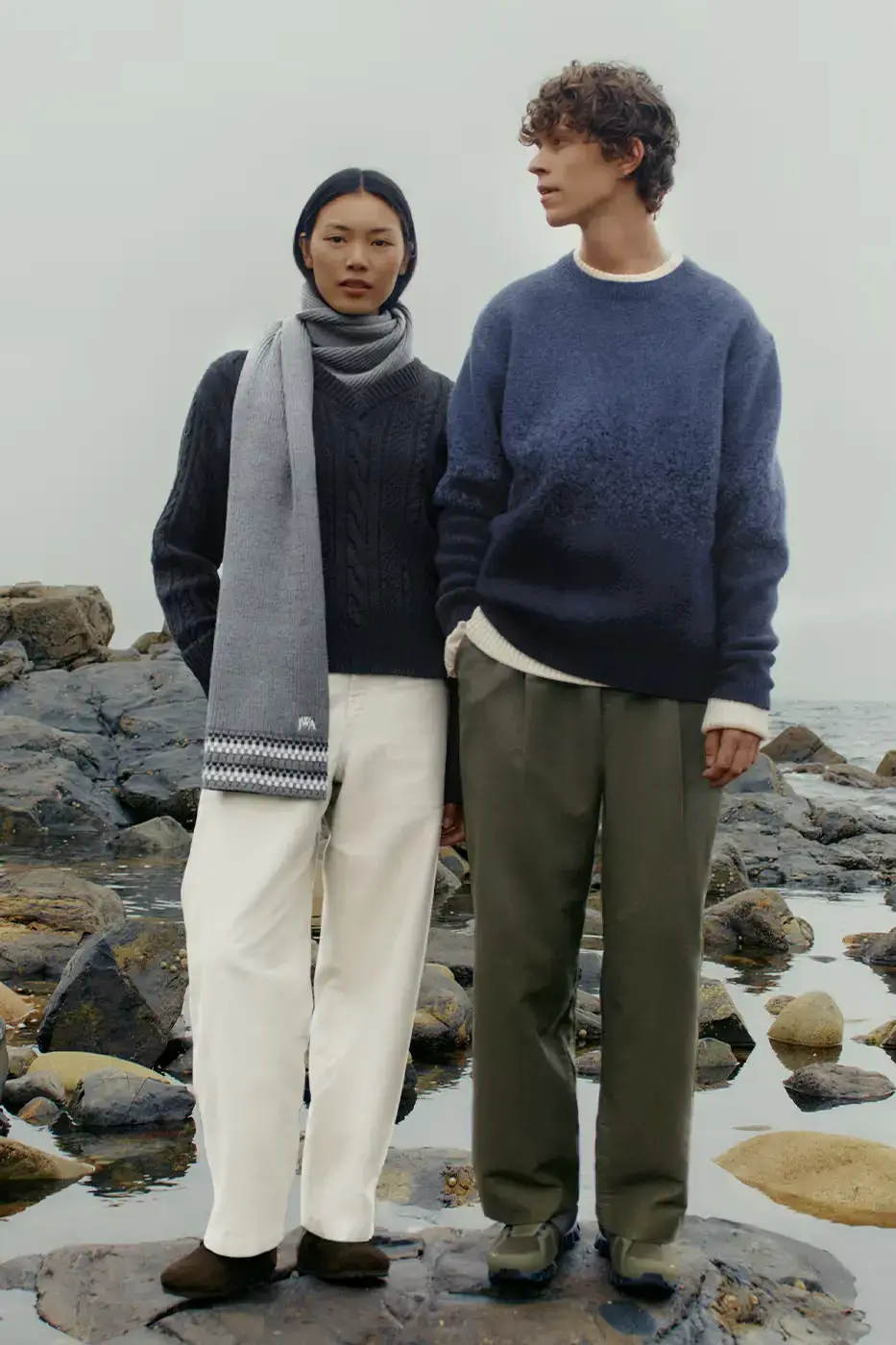 UNIQLO x JW Anderson Fall Winter 2024 collection display featuring coastal-inspired outerwear and knitwear against a minimalist background (image 2 of 7)