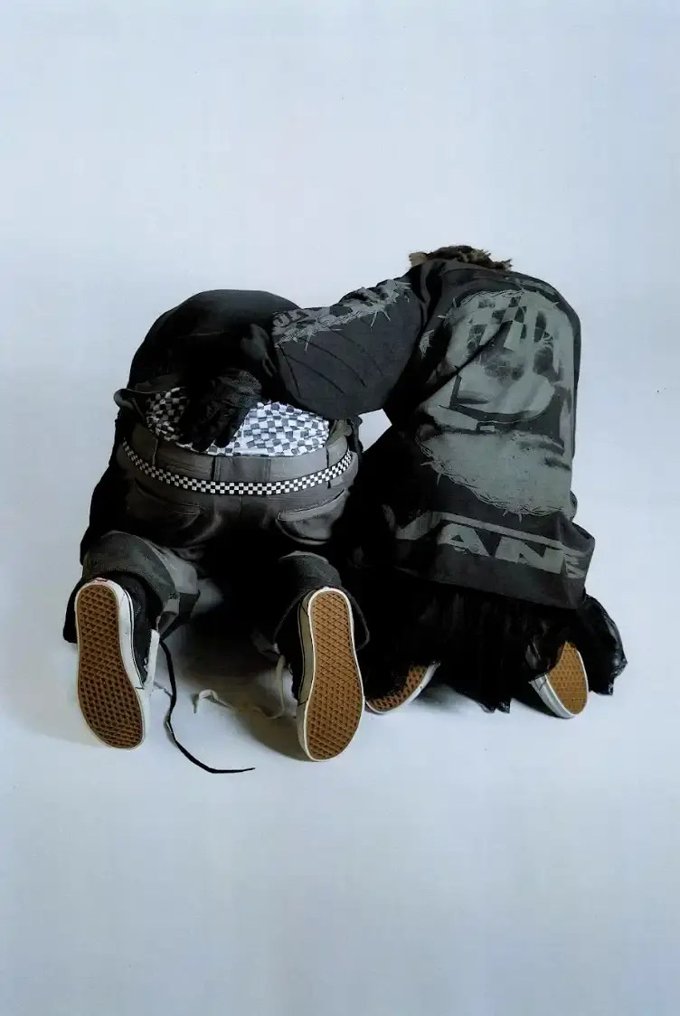 VANS AND SLAM JAM LAUNCH ACT OF DISAGREEMENT image about the collaboration between Vans and Slam Jam on a new clothing line called Act of Disagreement, featuring oversized hoodies, fleece jackets, and cropped pants. (image 4 of 9)