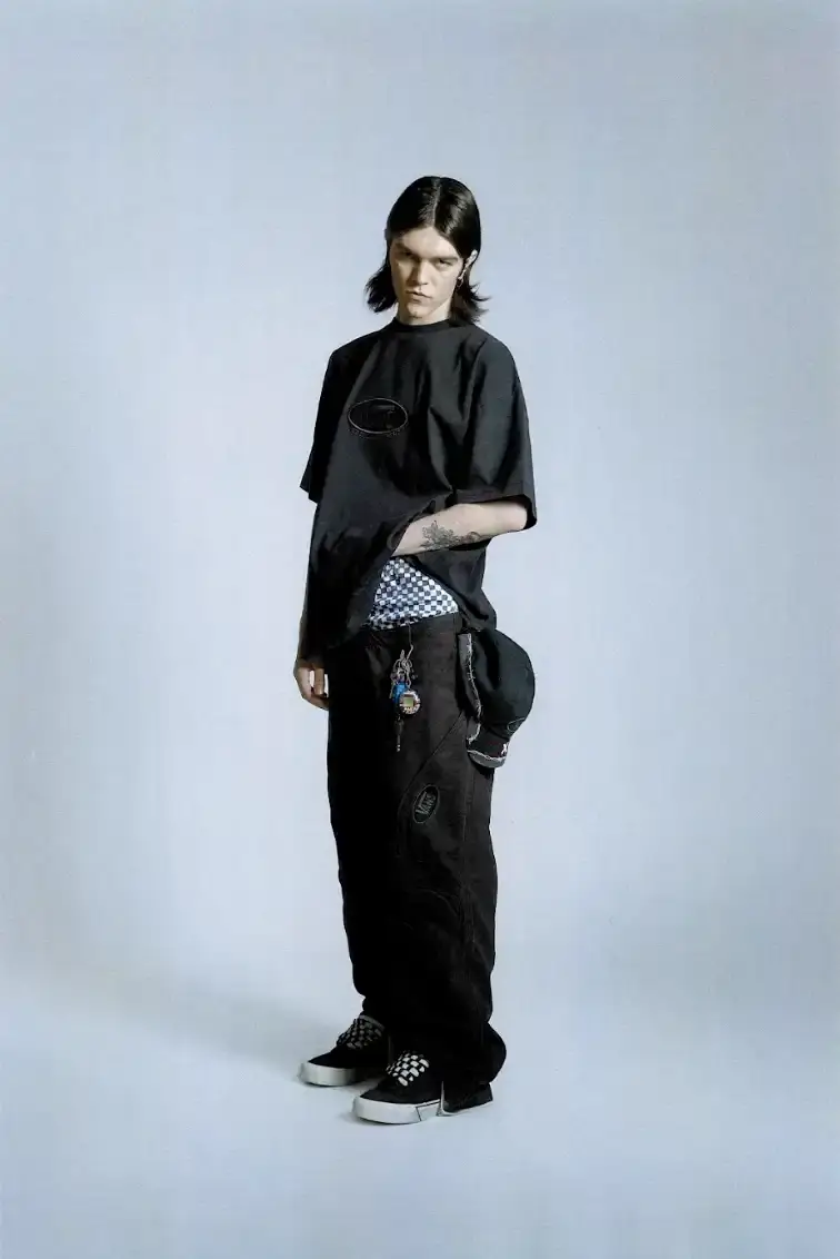 VANS AND SLAM JAM LAUNCH ACT OF DISAGREEMENT image about the collaboration between Vans and Slam Jam on a new clothing line called Act of Disagreement, featuring oversized hoodies, fleece jackets, and cropped pants. (image 2 of 9)