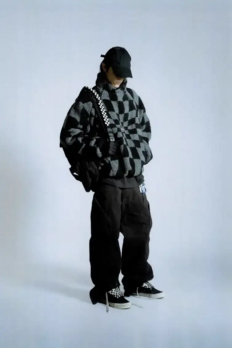 VANS AND SLAM JAM LAUNCH ACT OF DISAGREEMENT image about the collaboration between Vans and Slam Jam on a new clothing line called Act of Disagreement, featuring oversized hoodies, fleece jackets, and cropped pants.