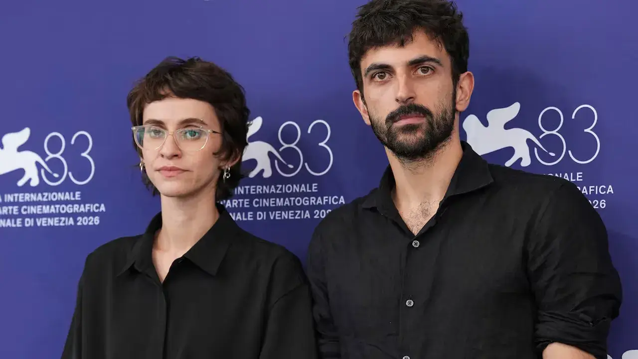 image of the directors of the documentary Naza, highlighting its record-breaking 25-minute standing ovation at the Venice Film Festival, directors, production partners, and soldier testimonies.