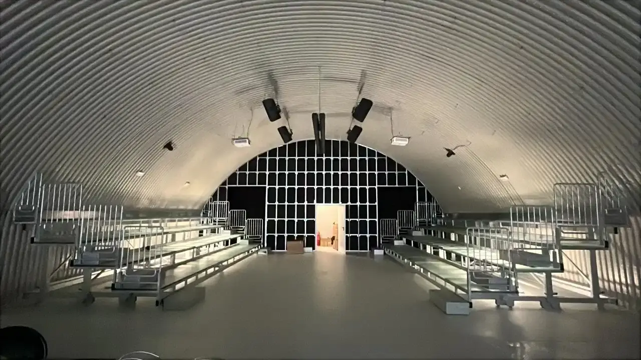 Article about the 15th edition of Video Sound Art festival taking place in Milan's Central Station underground storage facilities, with interview insights from director Laura Lamonea about the festival's evolution and approach to urban spaces.