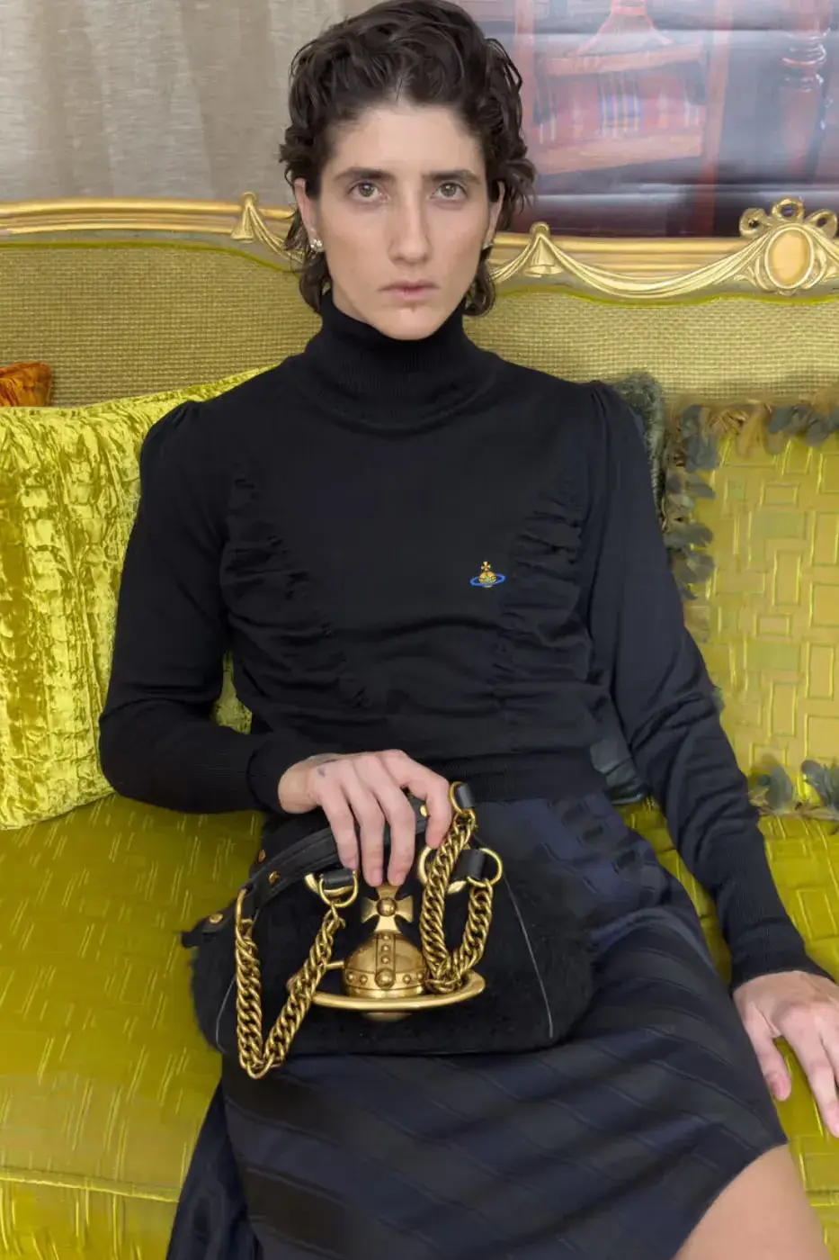 VIVIENNE WESTWOOD FW26 ITALIAN PUNK CAMPAIGN This image describes Vivienne Westwood's Fall Winter 2026 fashion campaign, featuring models in punk style knitwear posing among ornate Italian furniture. (image 7 of 15)
