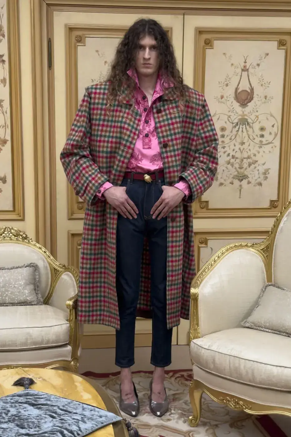 VIVIENNE WESTWOOD FW26 ITALIAN PUNK CAMPAIGN This image describes Vivienne Westwood's Fall Winter 2026 fashion campaign, featuring models in punk style knitwear posing among ornate Italian furniture. (image 15 of 15)