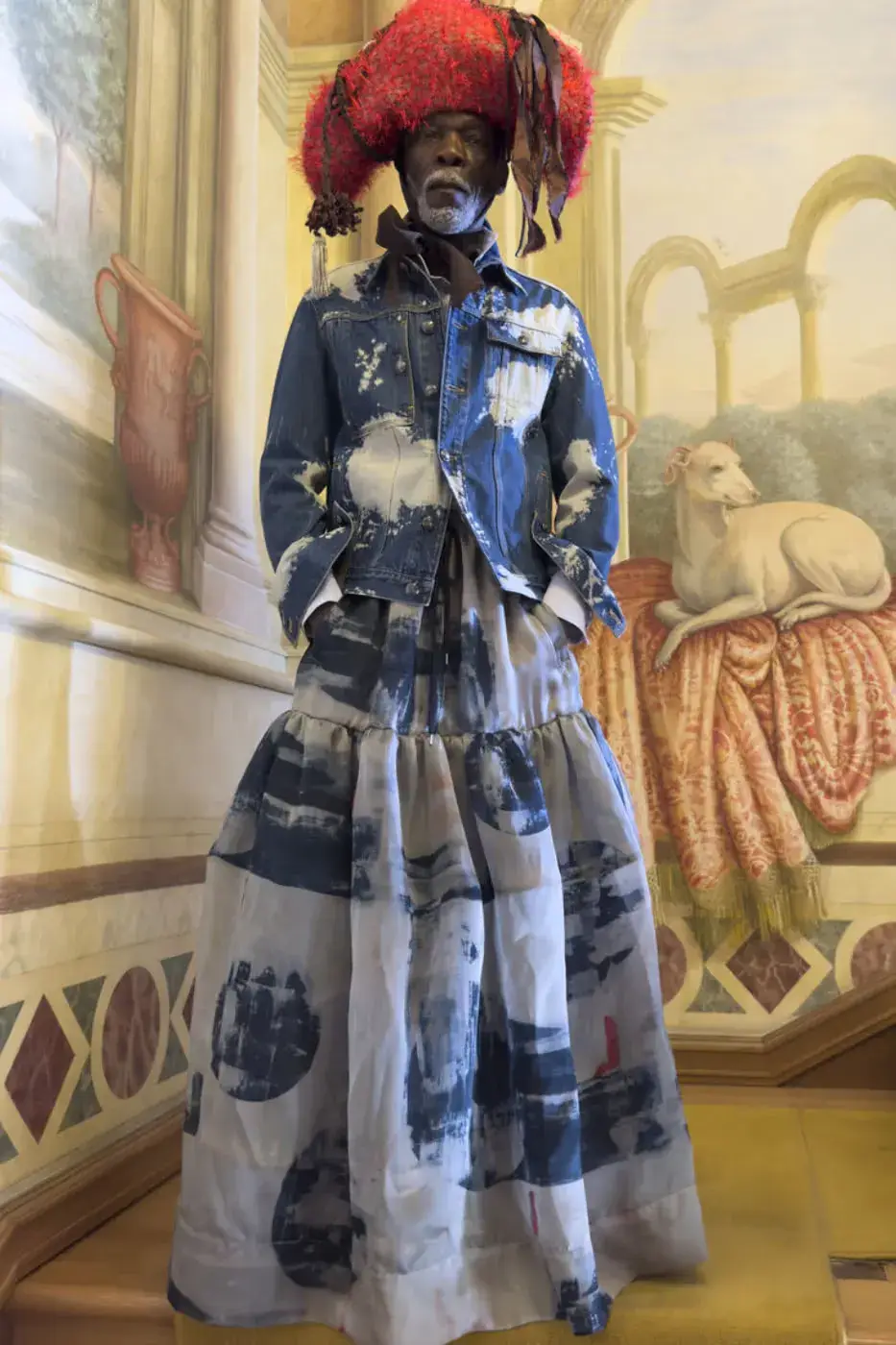 VIVIENNE WESTWOOD FW26 ITALIAN PUNK CAMPAIGN This image describes Vivienne Westwood's Fall Winter 2026 fashion campaign, featuring models in punk style knitwear posing among ornate Italian furniture. (image 2 of 15)
