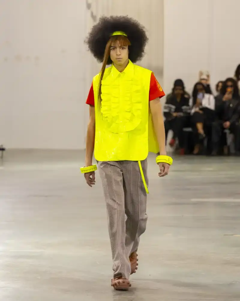 WALTER VAN BEIRENDONCK'S FALL/WINTER 2026 Belgian designer Walter Van Beirendonck presents his Fall/Winter 2026-2027 collection SCARE the CROW / SCARECROW, drawing from Art Brut influences and examining contemporary youth culture through contrasting elements of aggression and tenderness. (image 7 of 51)