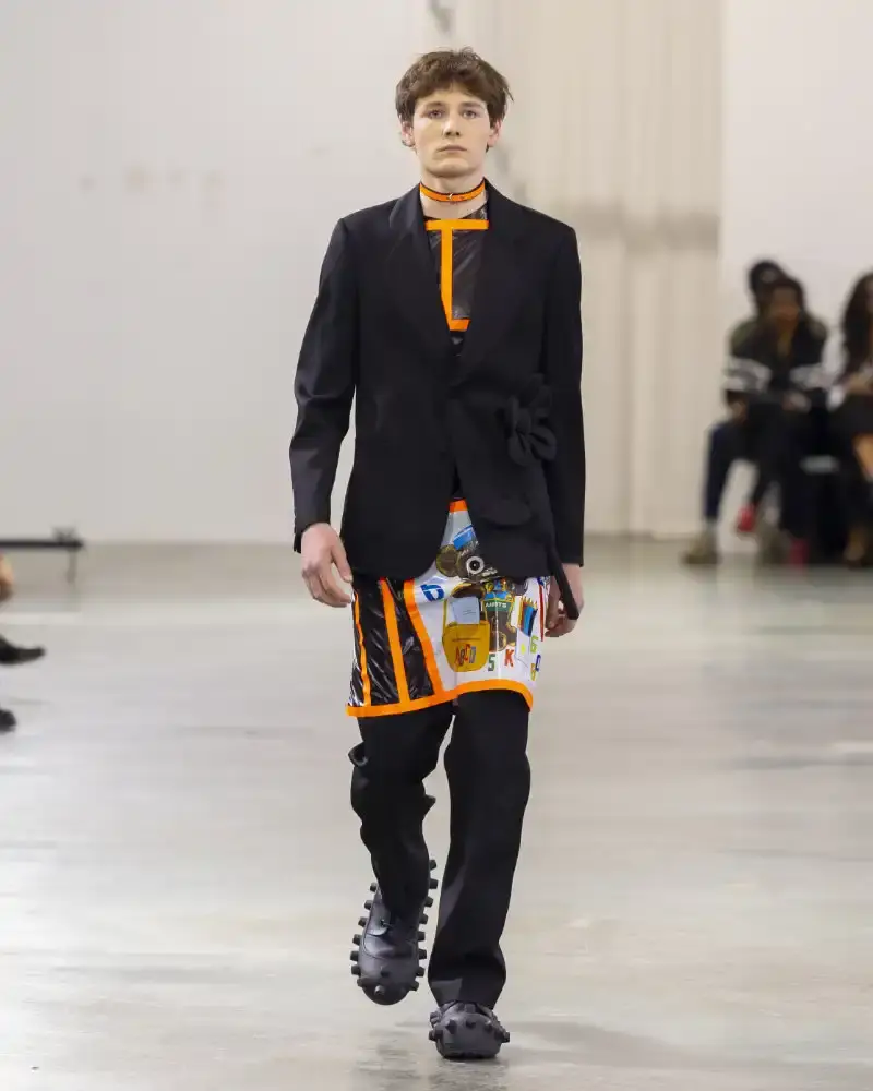WALTER VAN BEIRENDONCK'S FALL/WINTER 2026 Belgian designer Walter Van Beirendonck presents his Fall/Winter 2026-2027 collection SCARE the CROW / SCARECROW, drawing from Art Brut influences and examining contemporary youth culture through contrasting elements of aggression and tenderness. (image 50 of 51)