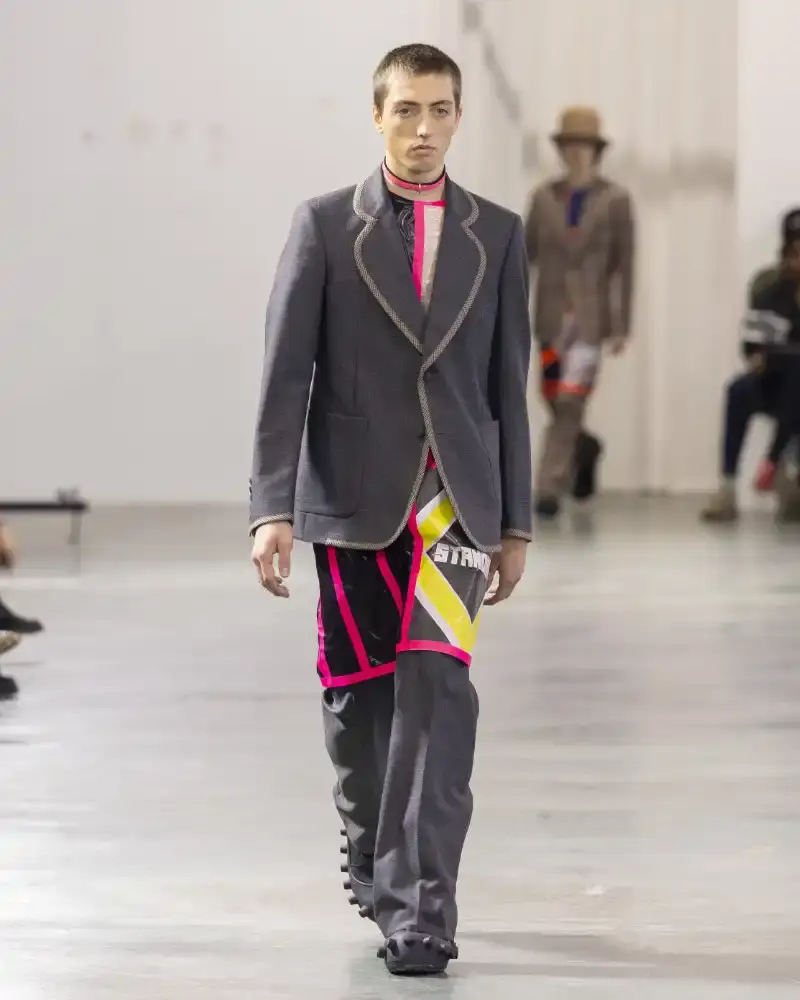 WALTER VAN BEIRENDONCK'S FALL/WINTER 2026 Belgian designer Walter Van Beirendonck presents his Fall/Winter 2026-2027 collection SCARE the CROW / SCARECROW, drawing from Art Brut influences and examining contemporary youth culture through contrasting elements of aggression and tenderness. (image 45 of 51)