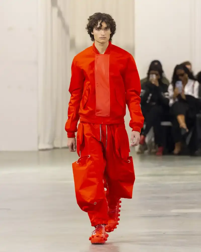 WALTER VAN BEIRENDONCK'S FALL/WINTER 2026 Belgian designer Walter Van Beirendonck presents his Fall/Winter 2026-2027 collection SCARE the CROW / SCARECROW, drawing from Art Brut influences and examining contemporary youth culture through contrasting elements of aggression and tenderness. (image 21 of 51)