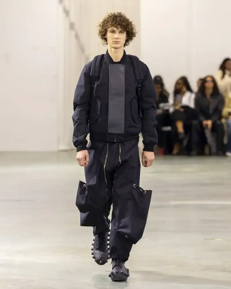 WALTER VAN BEIRENDONCK'S FALL/WINTER 2026 Belgian designer Walter Van Beirendonck presents his Fall/Winter 2026-2027 collection SCARE the CROW / SCARECROW, drawing from Art Brut influences and examining contemporary youth culture through contrasting elements of aggression and tenderness. (image 22 of 51)