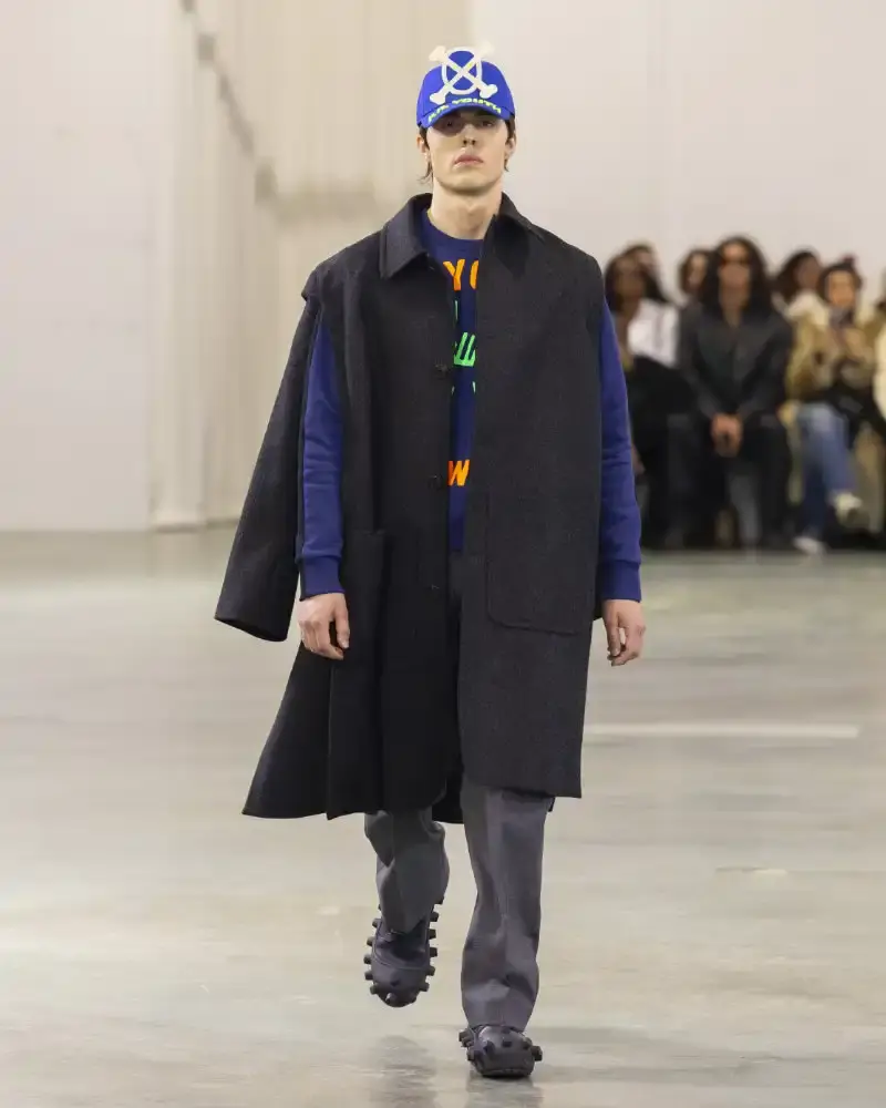 WALTER VAN BEIRENDONCK'S FALL/WINTER 2026 Belgian designer Walter Van Beirendonck presents his Fall/Winter 2026-2027 collection SCARE the CROW / SCARECROW, drawing from Art Brut influences and examining contemporary youth culture through contrasting elements of aggression and tenderness. (image 13 of 51)