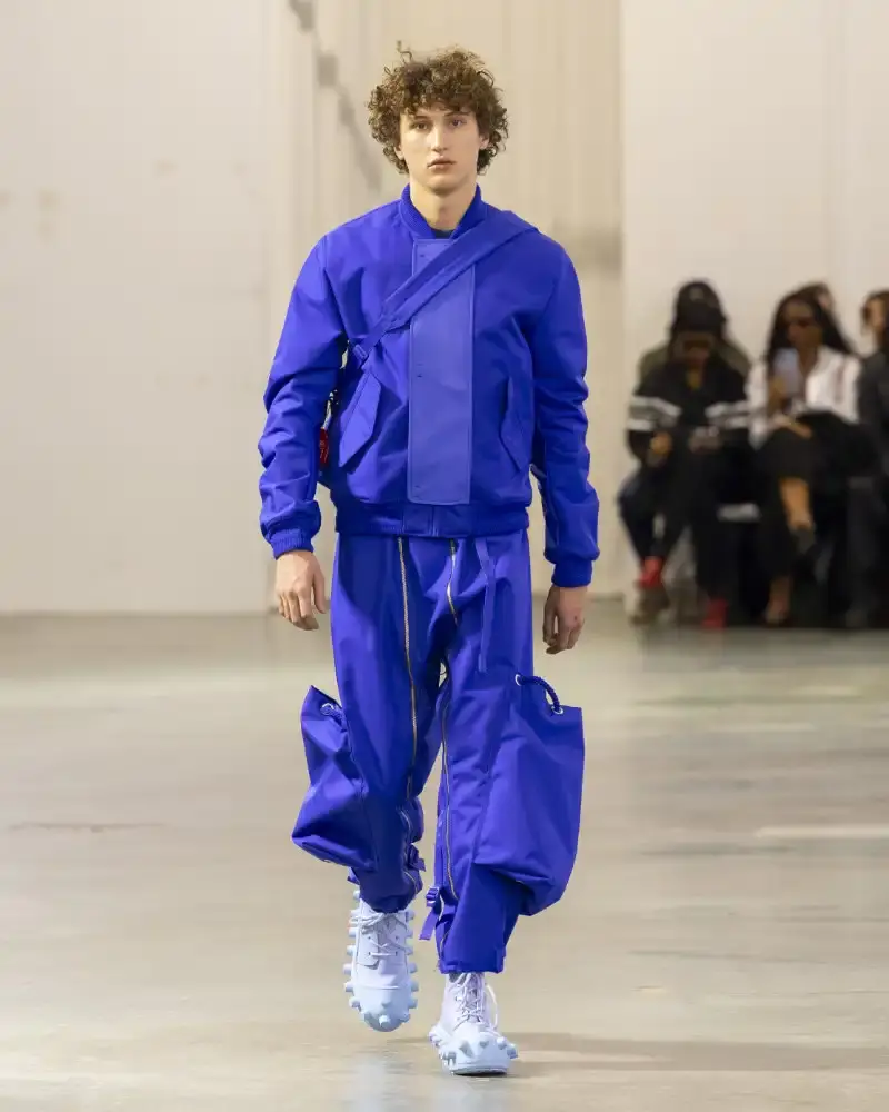 WALTER VAN BEIRENDONCK'S FALL/WINTER 2026 Belgian designer Walter Van Beirendonck presents his Fall/Winter 2026-2027 collection SCARE the CROW / SCARECROW, drawing from Art Brut influences and examining contemporary youth culture through contrasting elements of aggression and tenderness. (image 23 of 51)