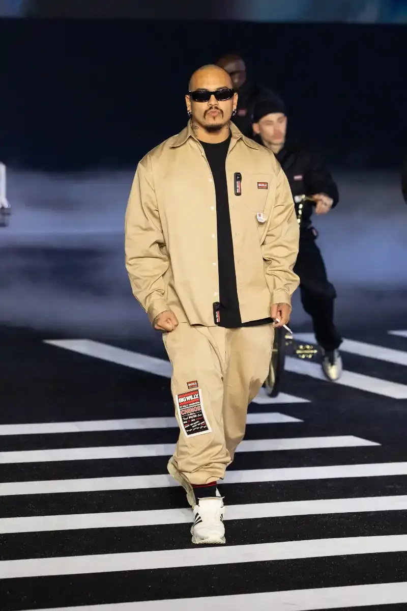 WILLY CHAVARRIA RETURNS TO PARIS FOR FALL/WINTER 2026 Fashion designer Willy Chavarria presented his Fall/Winter 2026 collection at Paris Fashion Week, featuring approximately 100 looks across three acts. The collection moved from everyday workwear through streetwear to fine tailoring, with improved fabrics and continued focus on representing real people. (image 18 of 47)