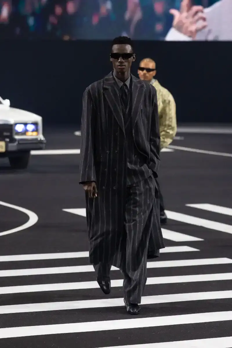 WILLY CHAVARRIA RETURNS TO PARIS FOR FALL/WINTER 2026 Fashion designer Willy Chavarria presented his Fall/Winter 2026 collection at Paris Fashion Week, featuring approximately 100 looks across three acts. The collection moved from everyday workwear through streetwear to fine tailoring, with improved fabrics and continued focus on representing real people. (image 41 of 47)