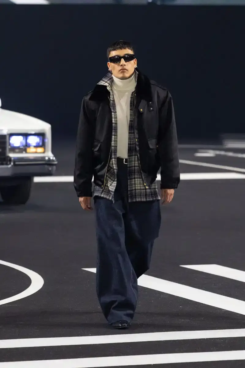 WILLY CHAVARRIA RETURNS TO PARIS FOR FALL/WINTER 2026 Fashion designer Willy Chavarria presented his Fall/Winter 2026 collection at Paris Fashion Week, featuring approximately 100 looks across three acts. The collection moved from everyday workwear through streetwear to fine tailoring, with improved fabrics and continued focus on representing real people. (image 19 of 47)