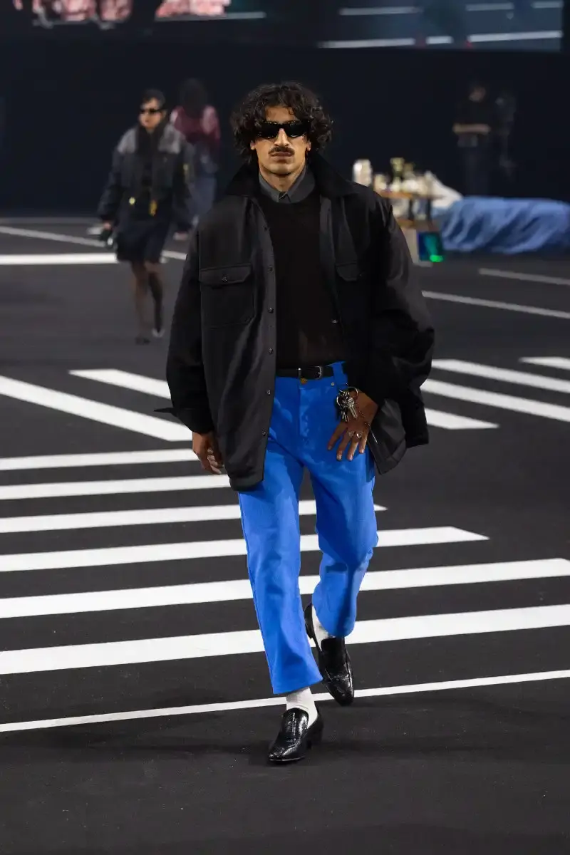 WILLY CHAVARRIA RETURNS TO PARIS FOR FALL/WINTER 2026 Fashion designer Willy Chavarria presented his Fall/Winter 2026 collection at Paris Fashion Week, featuring approximately 100 looks across three acts. The collection moved from everyday workwear through streetwear to fine tailoring, with improved fabrics and continued focus on representing real people. (image 24 of 47)