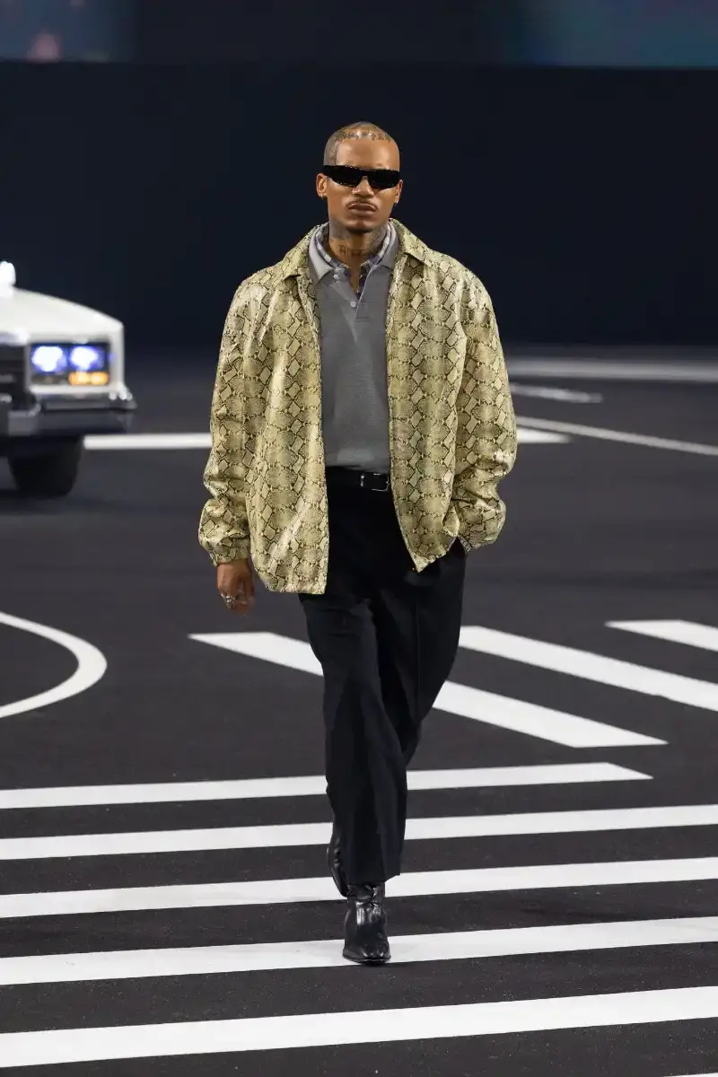 WILLY CHAVARRIA RETURNS TO PARIS FOR FALL/WINTER 2026 Fashion designer Willy Chavarria presented his Fall/Winter 2026 collection at Paris Fashion Week, featuring approximately 100 looks across three acts. The collection moved from everyday workwear through streetwear to fine tailoring, with improved fabrics and continued focus on representing real people. (image 40 of 47)