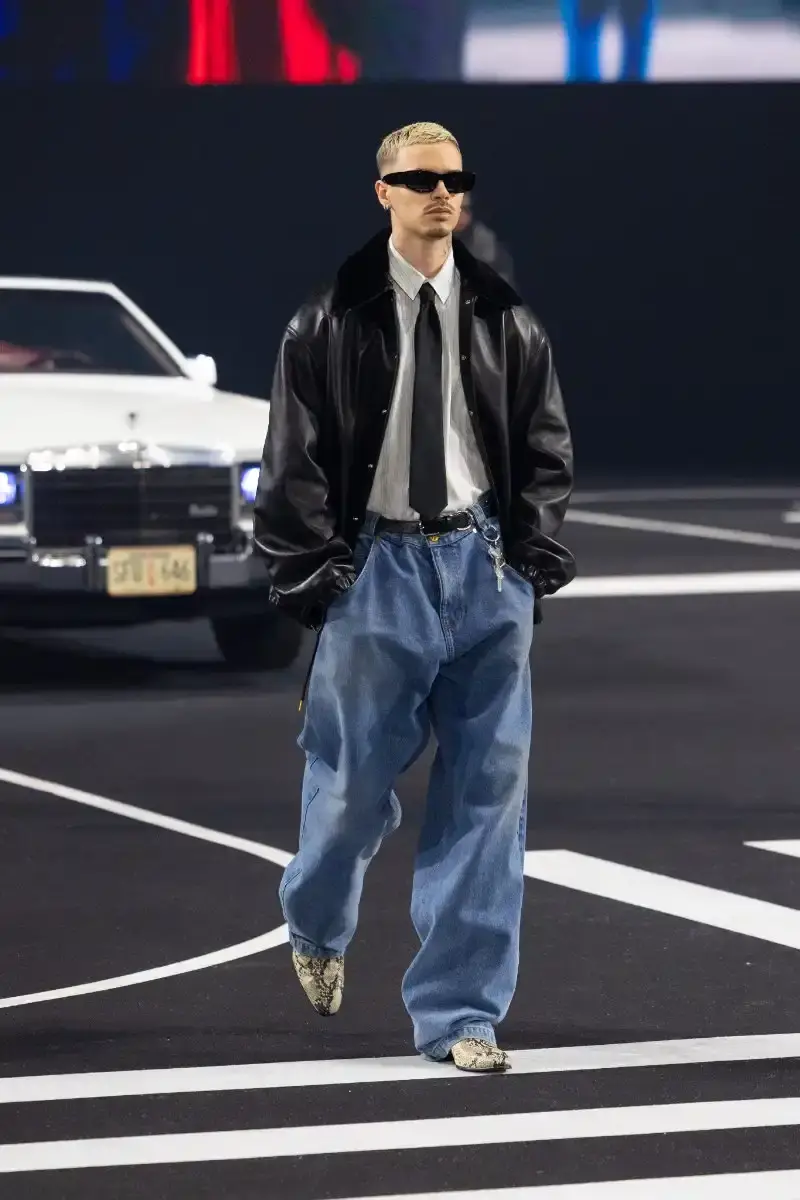 WILLY CHAVARRIA RETURNS TO PARIS FOR FALL/WINTER 2026 Fashion designer Willy Chavarria presented his Fall/Winter 2026 collection at Paris Fashion Week, featuring approximately 100 looks across three acts. The collection moved from everyday workwear through streetwear to fine tailoring, with improved fabrics and continued focus on representing real people. (image 25 of 47)