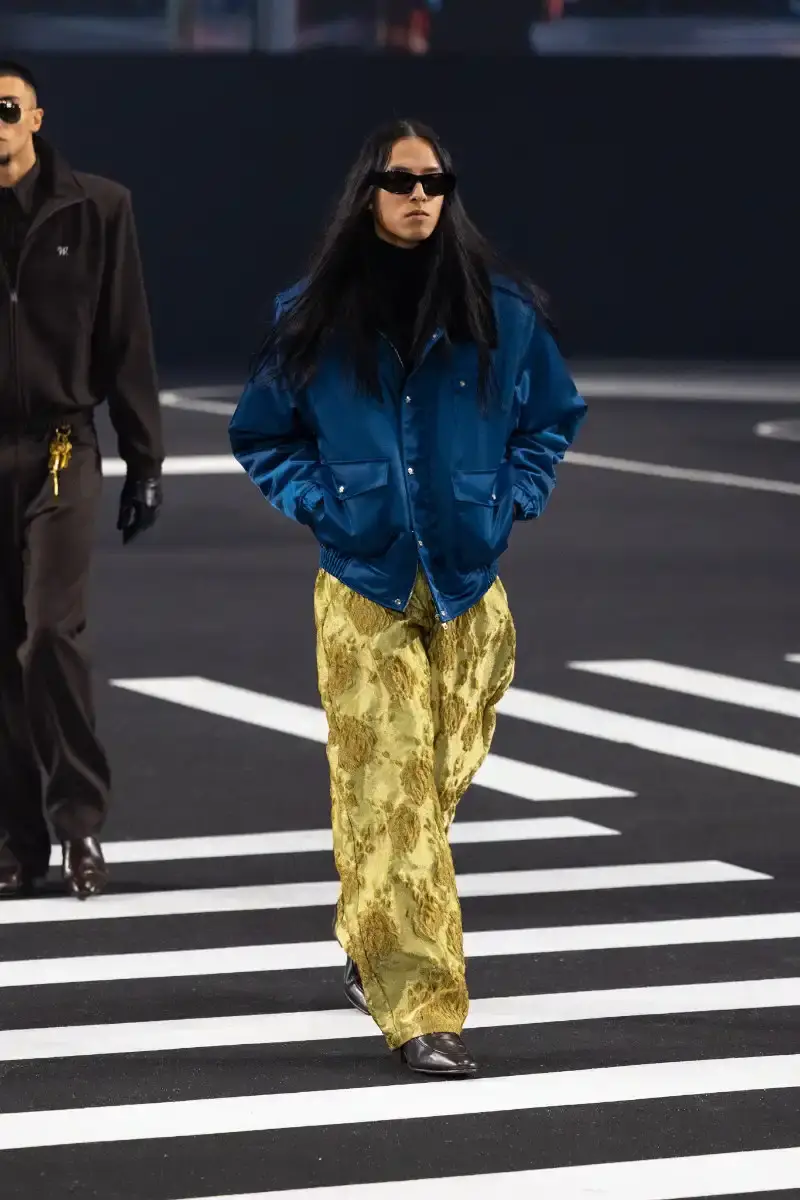 WILLY CHAVARRIA RETURNS TO PARIS FOR FALL/WINTER 2026 Fashion designer Willy Chavarria presented his Fall/Winter 2026 collection at Paris Fashion Week, featuring approximately 100 looks across three acts. The collection moved from everyday workwear through streetwear to fine tailoring, with improved fabrics and continued focus on representing real people. (image 21 of 47)