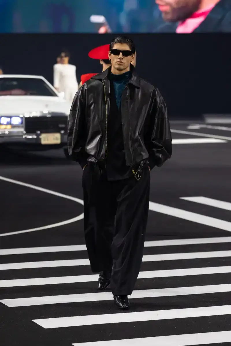 WILLY CHAVARRIA RETURNS TO PARIS FOR FALL/WINTER 2026 Fashion designer Willy Chavarria presented his Fall/Winter 2026 collection at Paris Fashion Week, featuring approximately 100 looks across three acts. The collection moved from everyday workwear through streetwear to fine tailoring, with improved fabrics and continued focus on representing real people. (image 7 of 47)