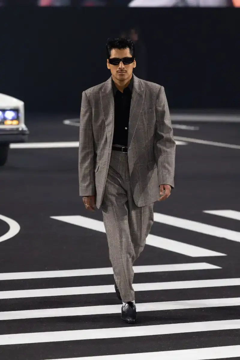 WILLY CHAVARRIA RETURNS TO PARIS FOR FALL/WINTER 2026 Fashion designer Willy Chavarria presented his Fall/Winter 2026 collection at Paris Fashion Week, featuring approximately 100 looks across three acts. The collection moved from everyday workwear through streetwear to fine tailoring, with improved fabrics and continued focus on representing real people. (image 45 of 47)