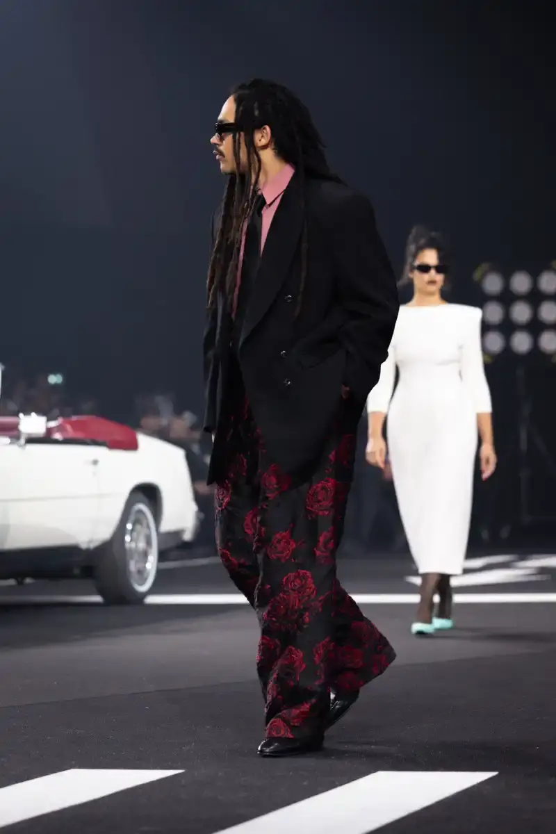 WILLY CHAVARRIA RETURNS TO PARIS FOR FALL/WINTER 2026 Fashion designer Willy Chavarria presented his Fall/Winter 2026 collection at Paris Fashion Week, featuring approximately 100 looks across three acts. The collection moved from everyday workwear through streetwear to fine tailoring, with improved fabrics and continued focus on representing real people. (image 6 of 47)
