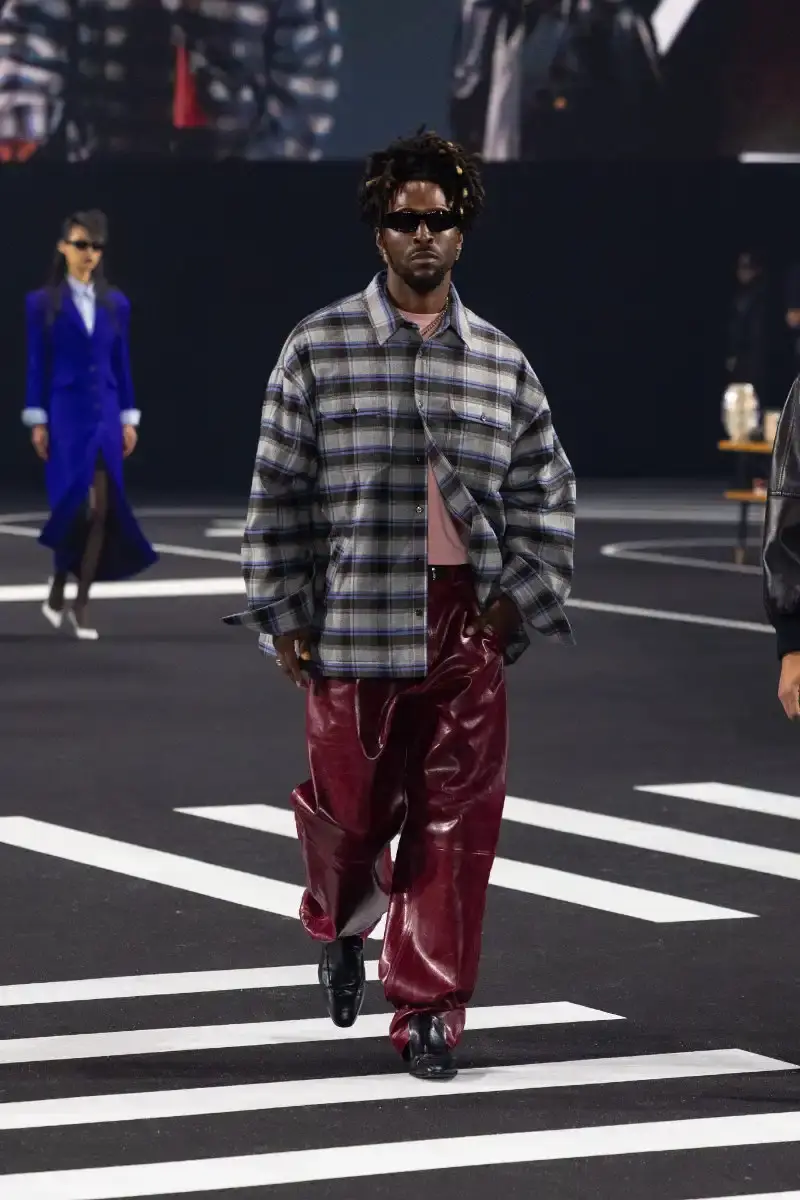 WILLY CHAVARRIA RETURNS TO PARIS FOR FALL/WINTER 2026 Fashion designer Willy Chavarria presented his Fall/Winter 2026 collection at Paris Fashion Week, featuring approximately 100 looks across three acts. The collection moved from everyday workwear through streetwear to fine tailoring, with improved fabrics and continued focus on representing real people. (image 26 of 47)
