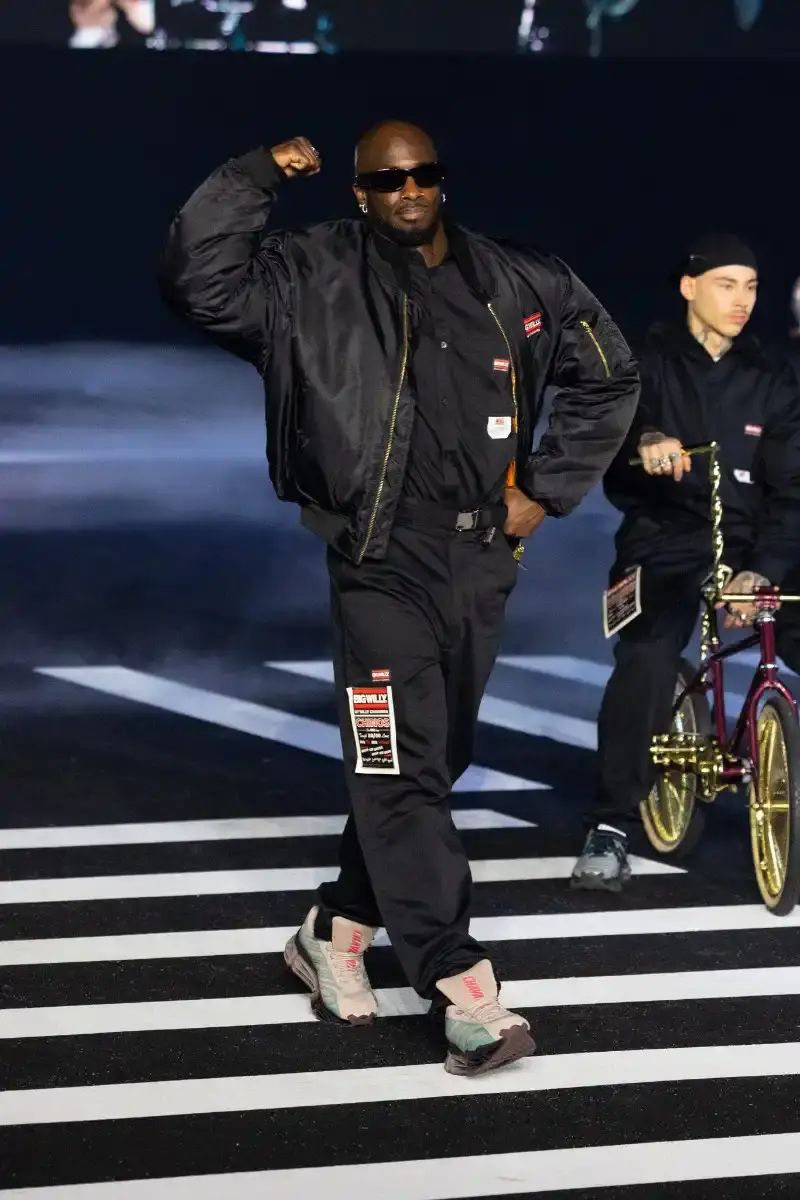 WILLY CHAVARRIA RETURNS TO PARIS FOR FALL/WINTER 2026 Fashion designer Willy Chavarria presented his Fall/Winter 2026 collection at Paris Fashion Week, featuring approximately 100 looks across three acts. The collection moved from everyday workwear through streetwear to fine tailoring, with improved fabrics and continued focus on representing real people. (image 17 of 47)