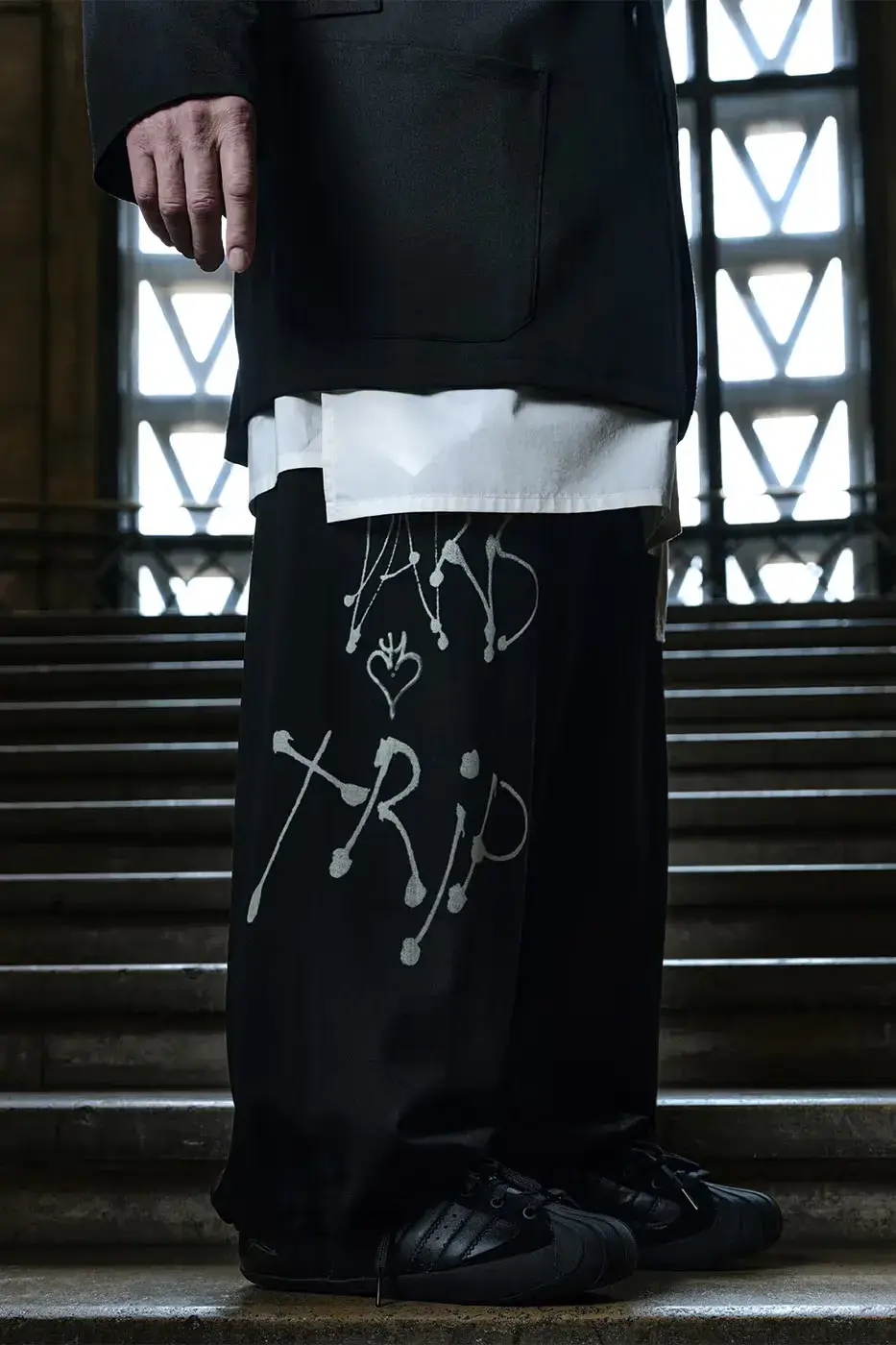 Y-3 FW26 CAMPAIGN FEATURES MARK GONZALES An editorial article detailing the Y-3 Fall/Winter 2026 campaign. The text describes the apparel and footwear, focusing on the collaboration between Adidas, Yohji Yamamoto, and Mark Gonzales. (image 9 of 14)