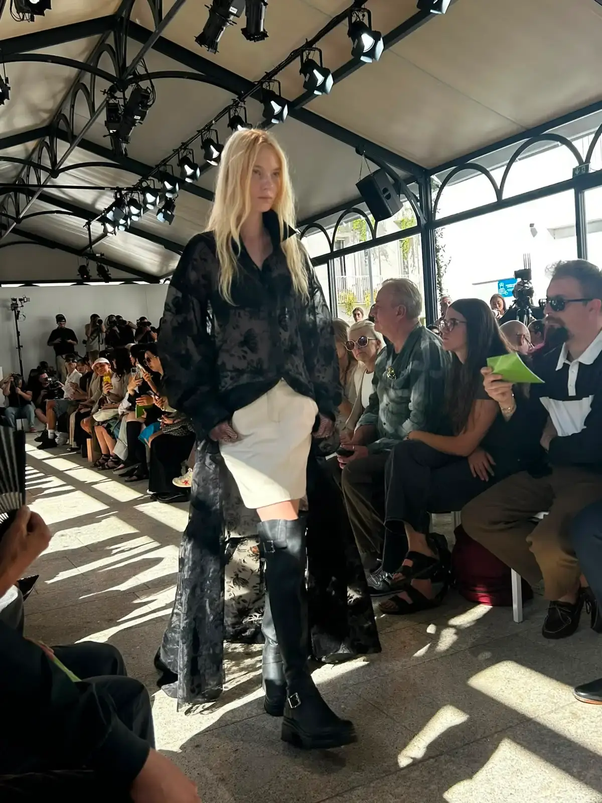 YEZAEL "VERITÀ" COLLECTION BY ANGELO CRUCIANI An editorial article discussing Marche-born designer Angelo Cruciani's "Verità" collection for Yezael presented at Fashion Week 2026. The text describes tailored suits with wide-leg trousers, 3D floral appliqués, an ochre-yellow coat, a pastel-blue Rococo-inspired suit, and contrasting textures combining leather and pearls. Key quotes and philosophical reflections explore fashion, consumerism, nature, and personal identity.