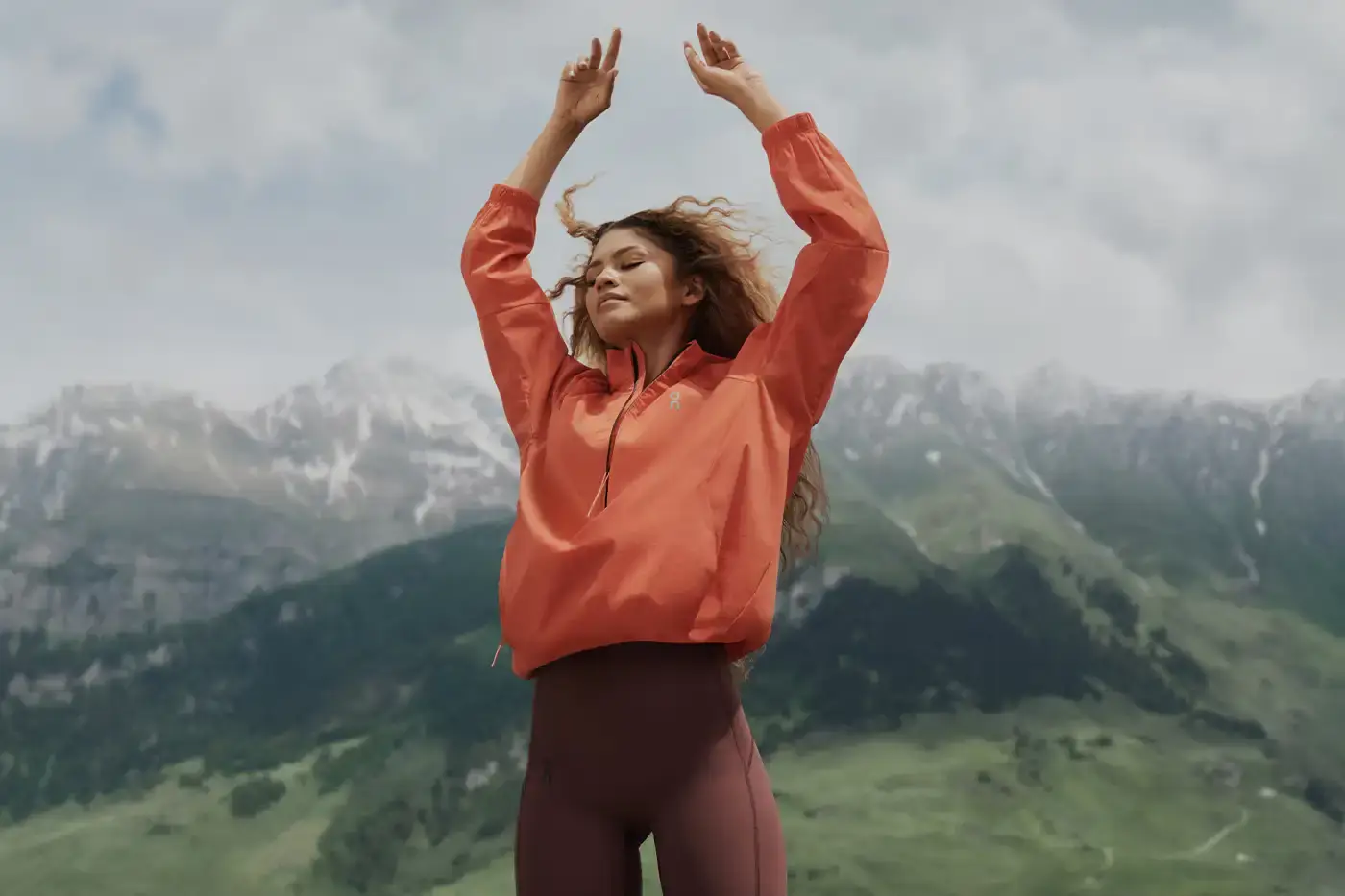 Zendaya exploring mountain trails in On's half-zip windbreaker